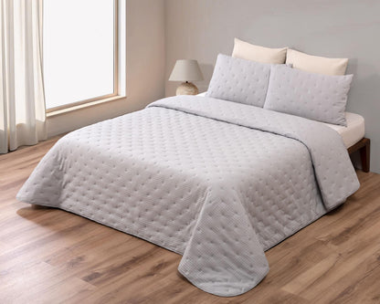 Colcha Chloe incluye dos cojines rellenos 40x60 efecto algodon